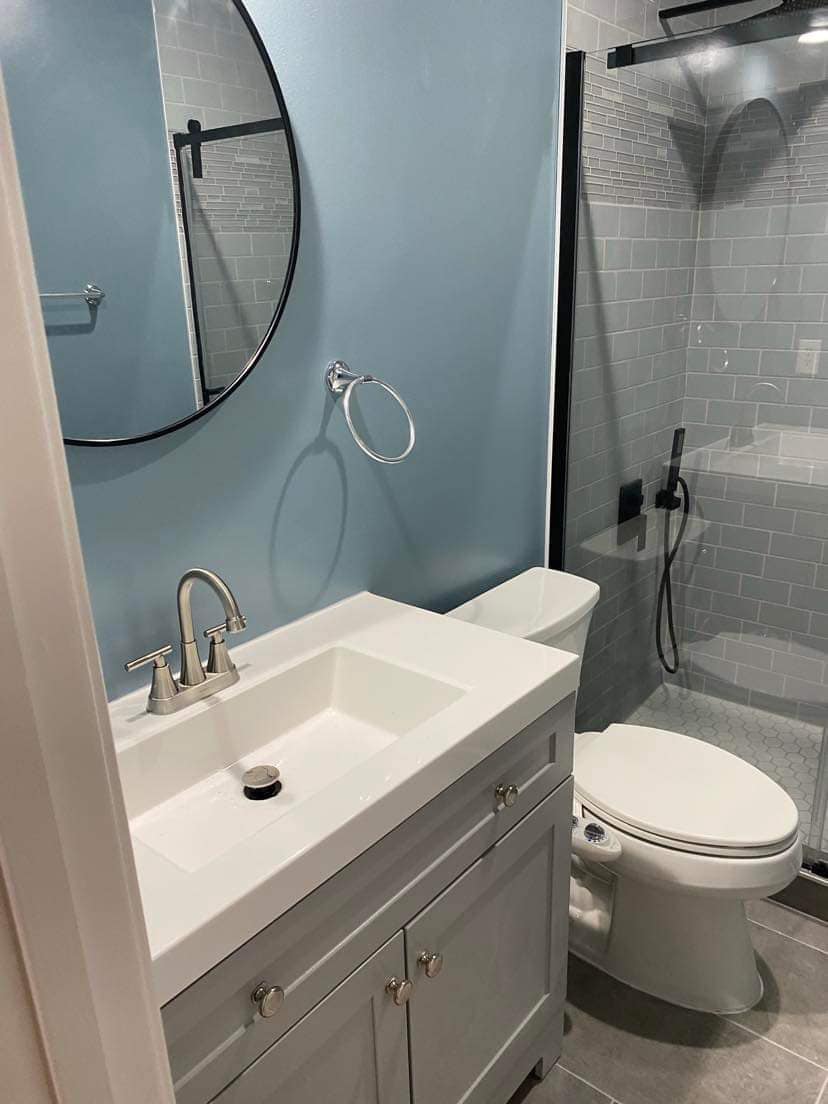 Completed bathroom remodeling project with tile shower vanity and fixtures by Always Best Solutions LLC